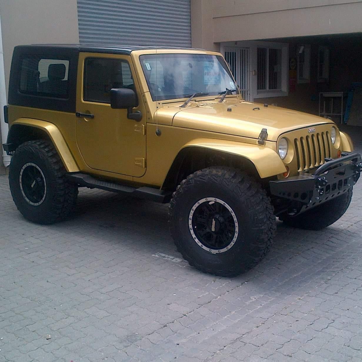 Gold Jeep Wrangler at Marco's